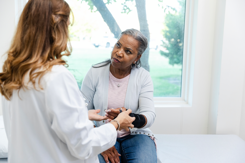 Female orthopedist explains recovery process to the mature female patient - stock photo
After having surgery, the female orthopedist explains the recovery process to the mature female patient.