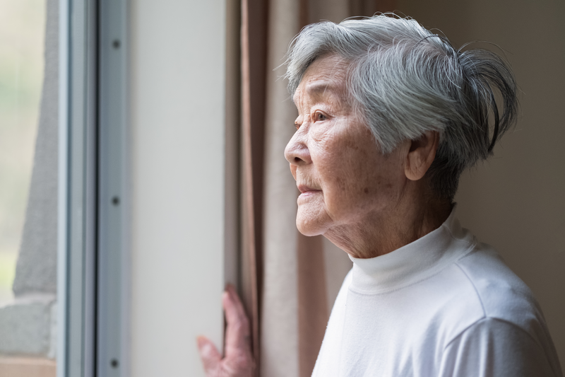 Serious Asian Senior Woman in 90s Looking Out of Window - stock photo
Chinese senior woman looking outside.