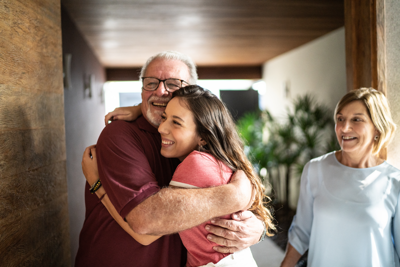 Granddaughter embracing grandfather at home - stock photo
Granddaughter embracing grandfather at home