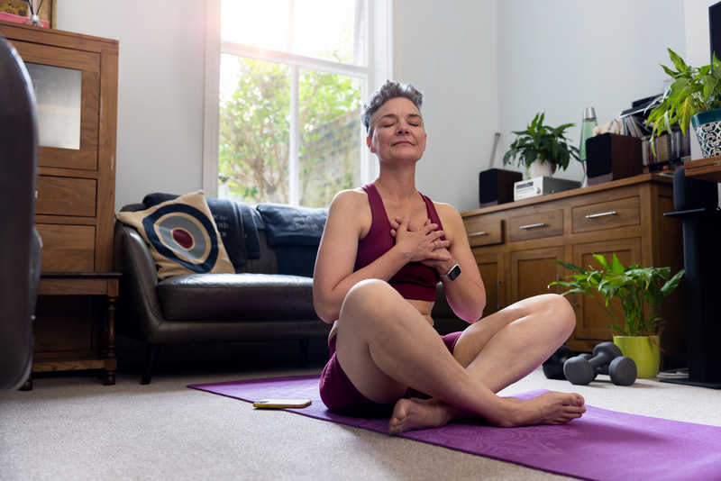 Taking time To Myself - stock photo
Full shot of mature adult sitting with her legs crossed on an exercise mat, with her eyes closed. She has her hands on her chest. She is wearing gym gear.