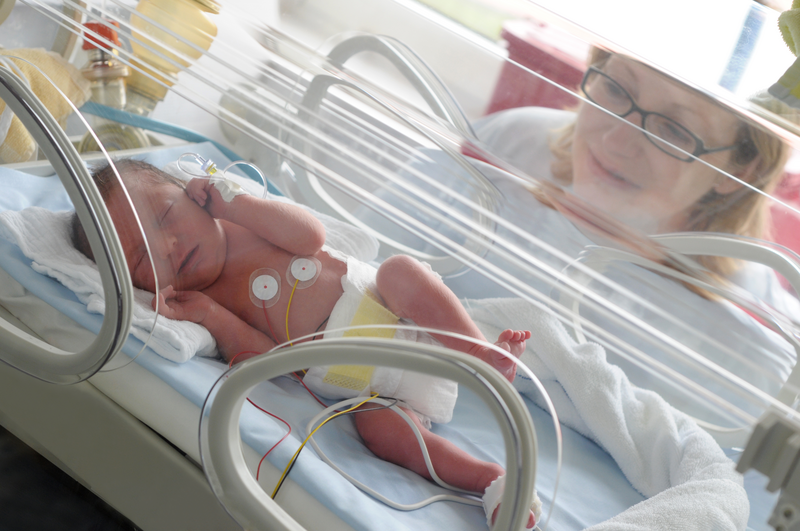 Newborn baby in incubator - stock photo
Newborn Premature in Incubator